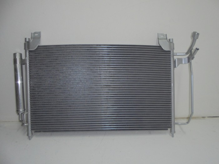 Радиатор кондиционера CX-7 06-09