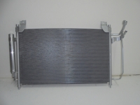 Радиатор кондиционера CX-7 06-09
